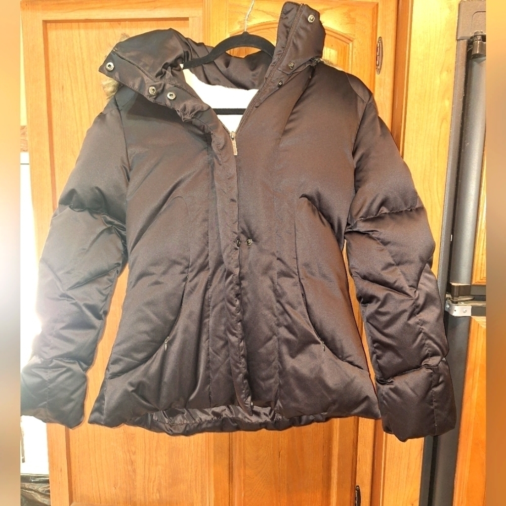 A Clavin Klein ladies medium down filled puffer coat with a hood in Expresso